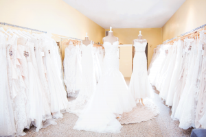 Bride trying on wedding dress during private VIP appointment at The Dressing Room St Petersburg Florida bridal boutique with entire store to herself
