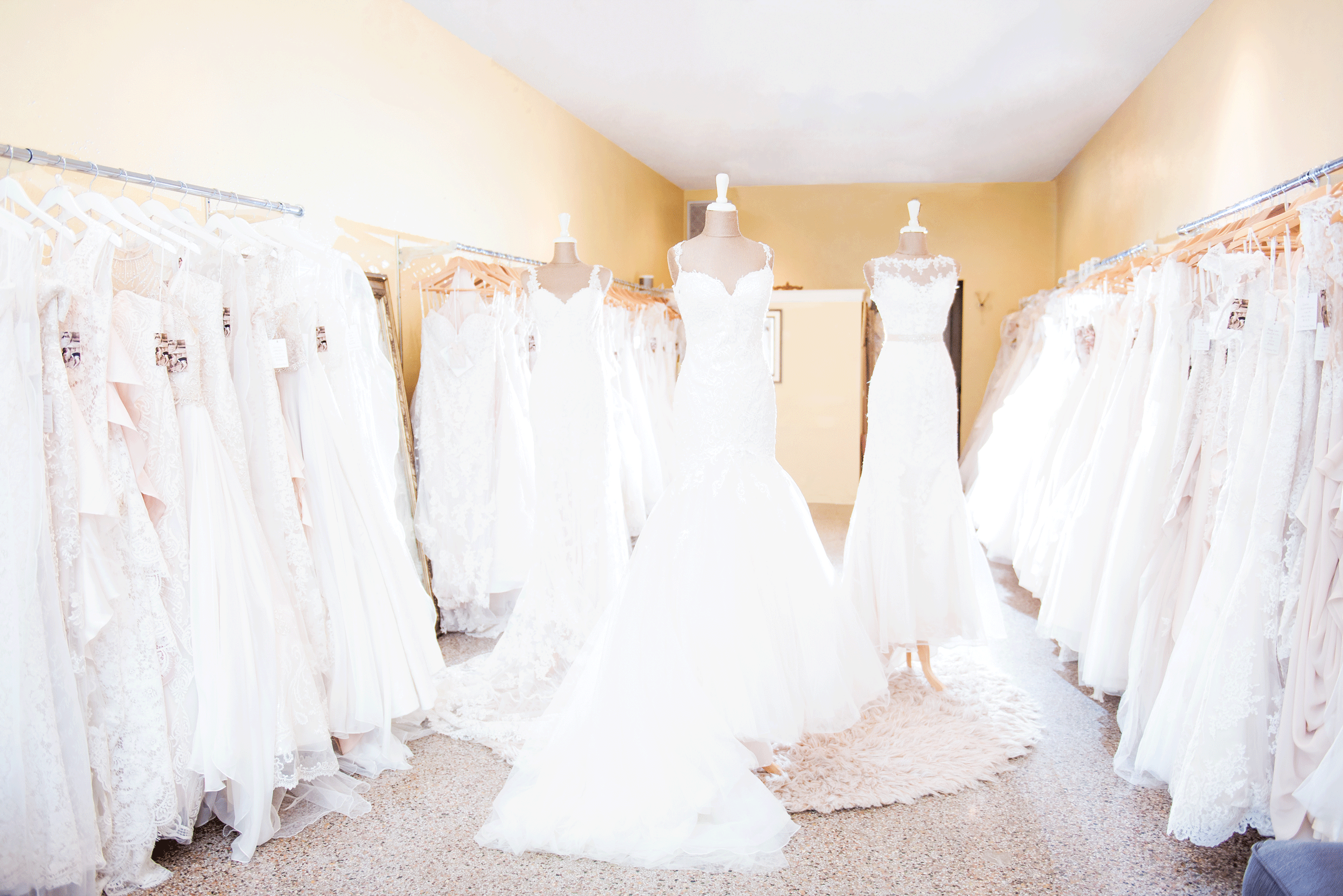 Bride trying on wedding dress during private VIP appointment at The Dressing Room St Petersburg Florida bridal boutique with entire store to herself